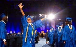 Student celebrating at commencement ceremony. 