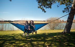 Students enjoy the first warm, sunny day of the spring on North Campus near Baird Point and Lake La Salle. 