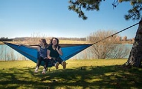Students enjoy the first warm, sunny day of the spring on North Campus near Baird Point and Lake La Salle. 